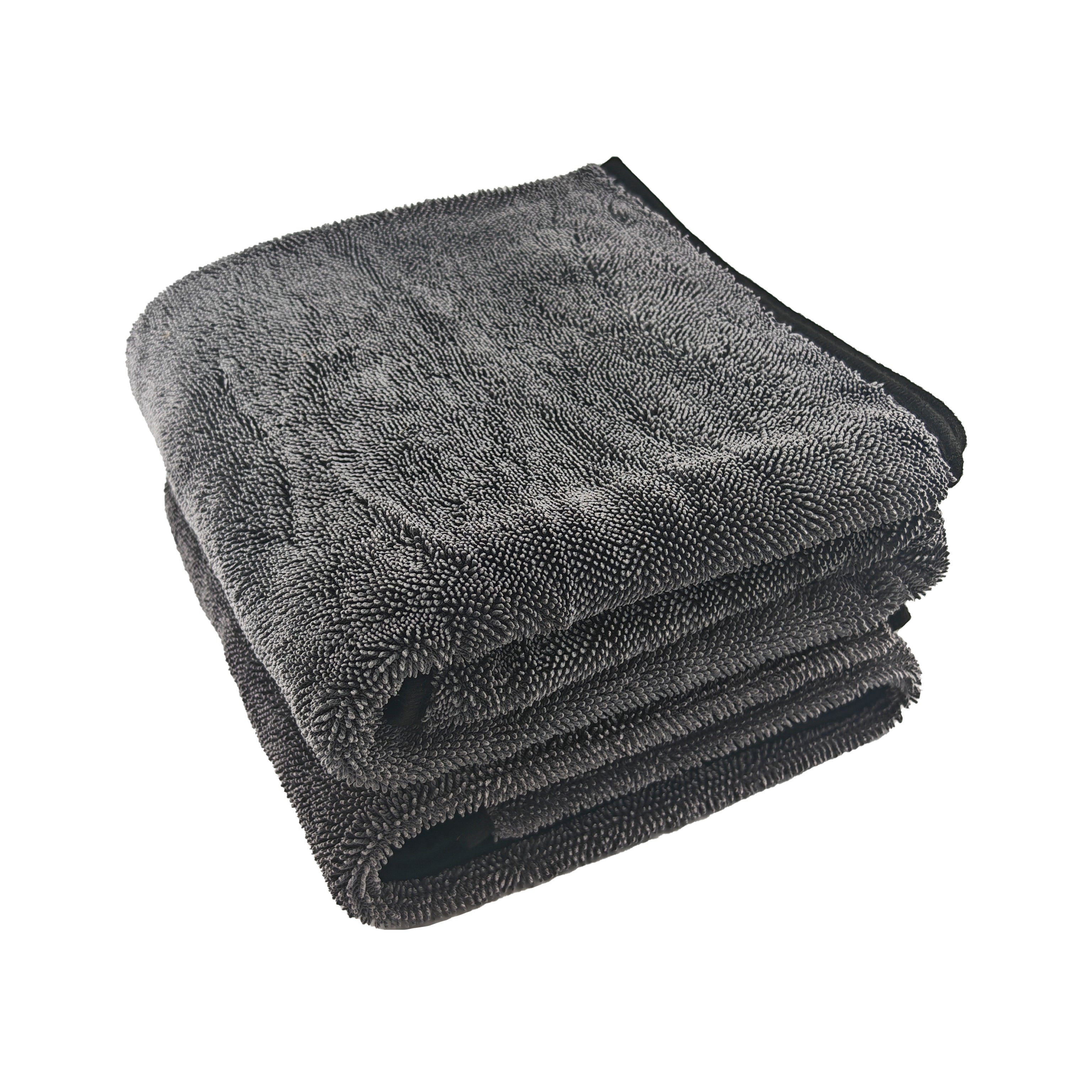 Stack of gray microfiber cloths on a white background