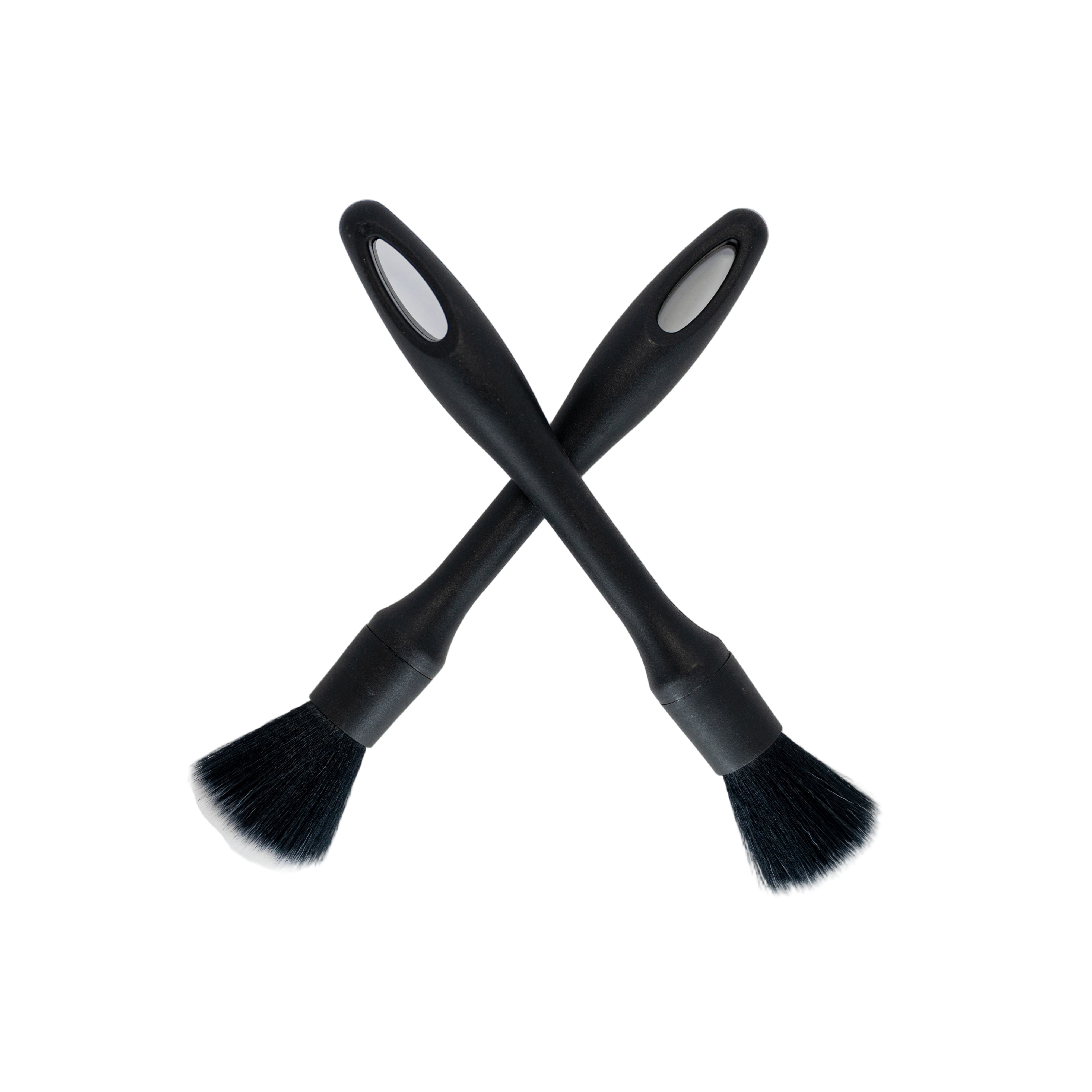 Two black brushes with bristle heads on a white background