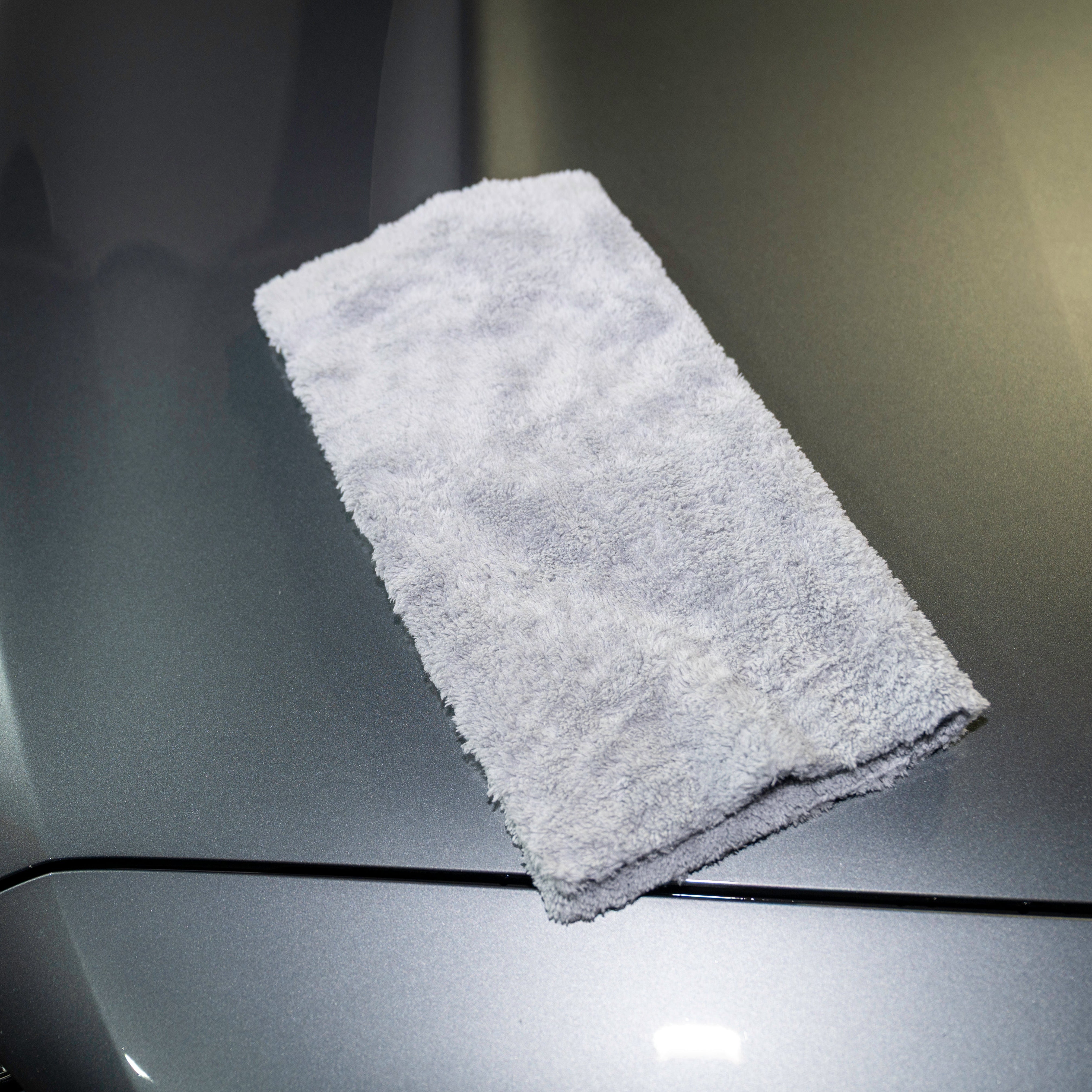 Gray towel on a car's hood