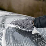 Person cleaning a car with the soapy Chanille Wash Mitt