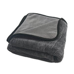 Folded gray Drying Towel 600GSM with black border on a white background