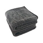 Stack of gray microfiber cloths on a white background
