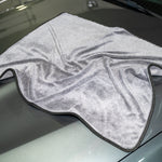 Gray microfiber towel on a car hood