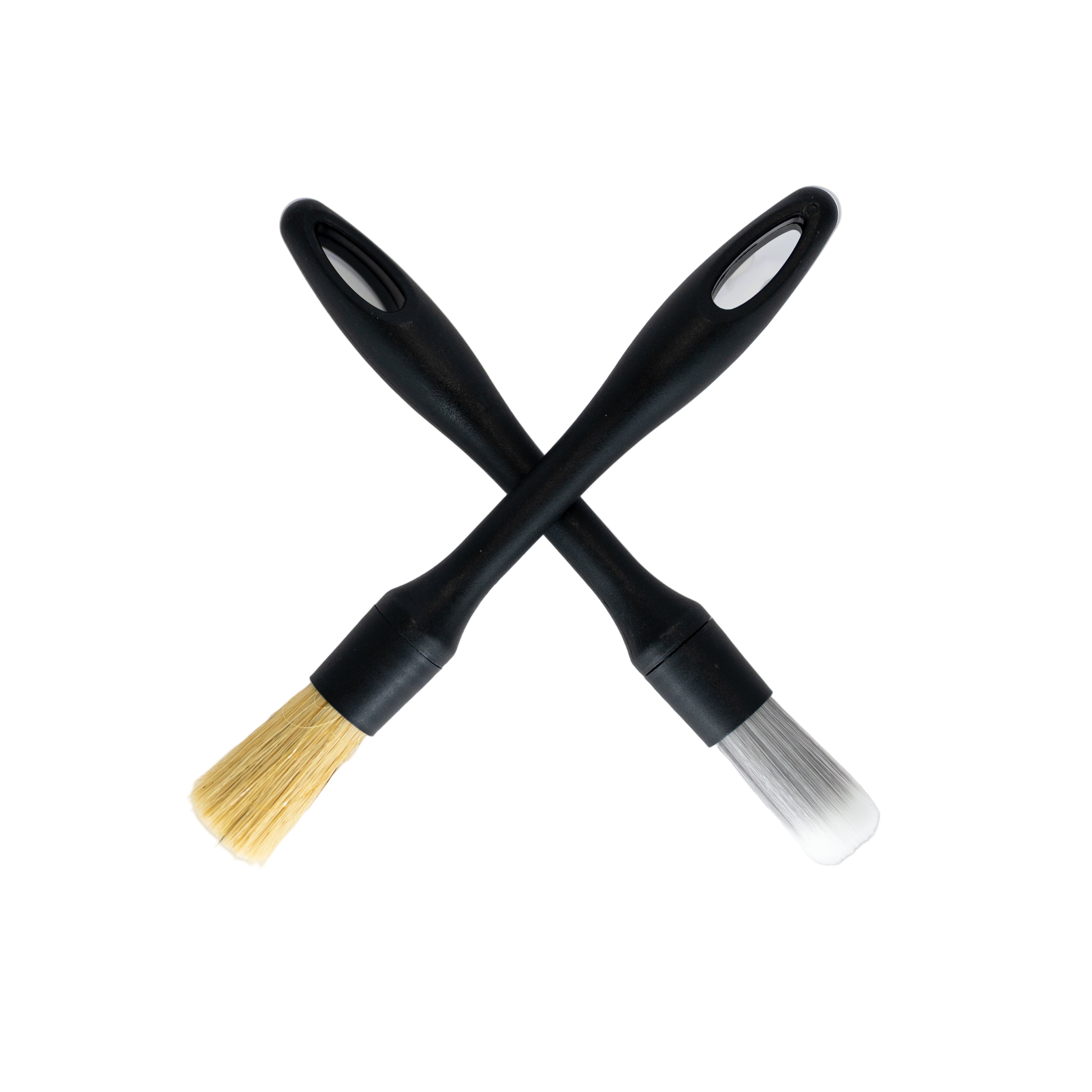 Two black brushes with yellow bristle and gray bristle on a white background