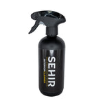 Black spray bottle labeled 'SEHIR Interior Cleaner' on a gray background