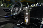 SEHIR car interior cleaner bottle on a car dashboard