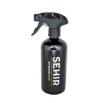 Black spray bottle with 'SEHIR' branding on a white background