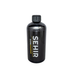 Black shampoo bottle with 'SEHIR' branding on a gray background