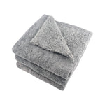 Stack of gray towels on a white background