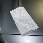 Gray towel on a car's hood